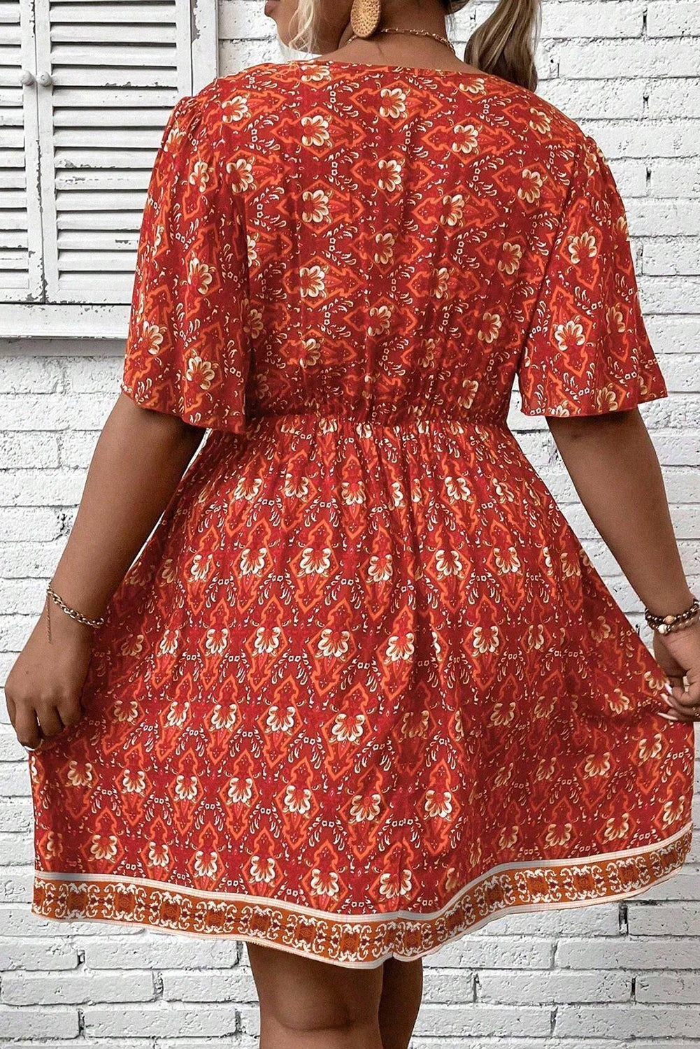 Orange Plus Size Printed Surplice Neck Empire Waist Flowy Mini Dress